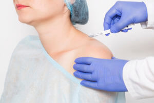 Orthopedic surgeon giving demo of Shoulder replacement surgery