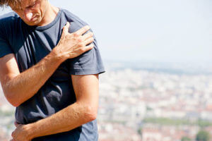 A male person, having severe shoulder pain, maybe due to an impingement syndrome. XXL size image.